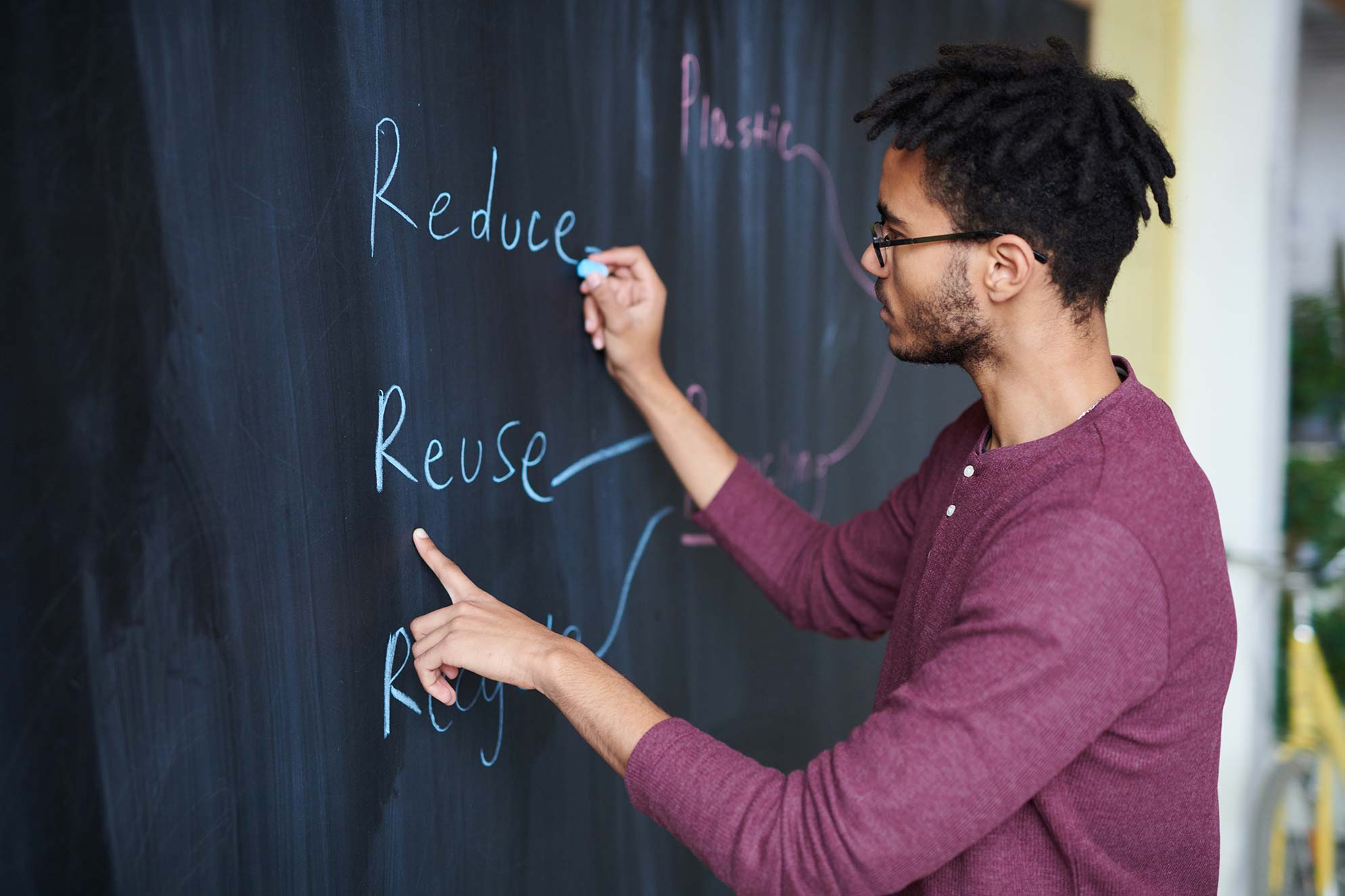 Man Drawing on Chalkboard